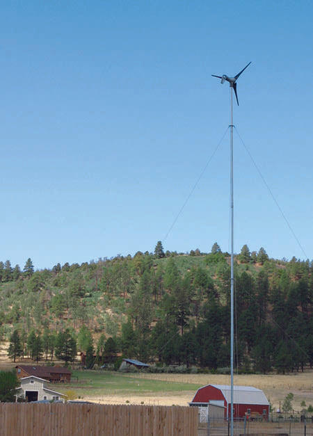 air 30 turbine on tall pole next to barn