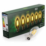 ECO B15 4W LED Candle bulb lying next to 4-bulb box